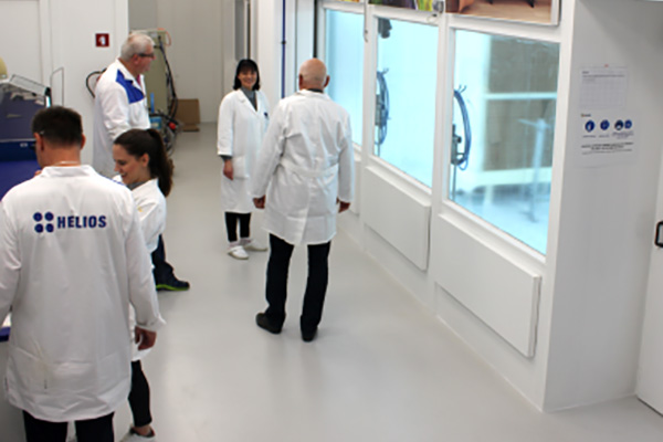 Five people in a technical training room for metal coatings